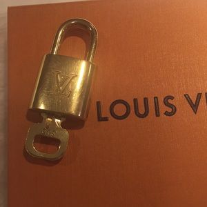 Authentic L Vuitton Padlock w/key 303